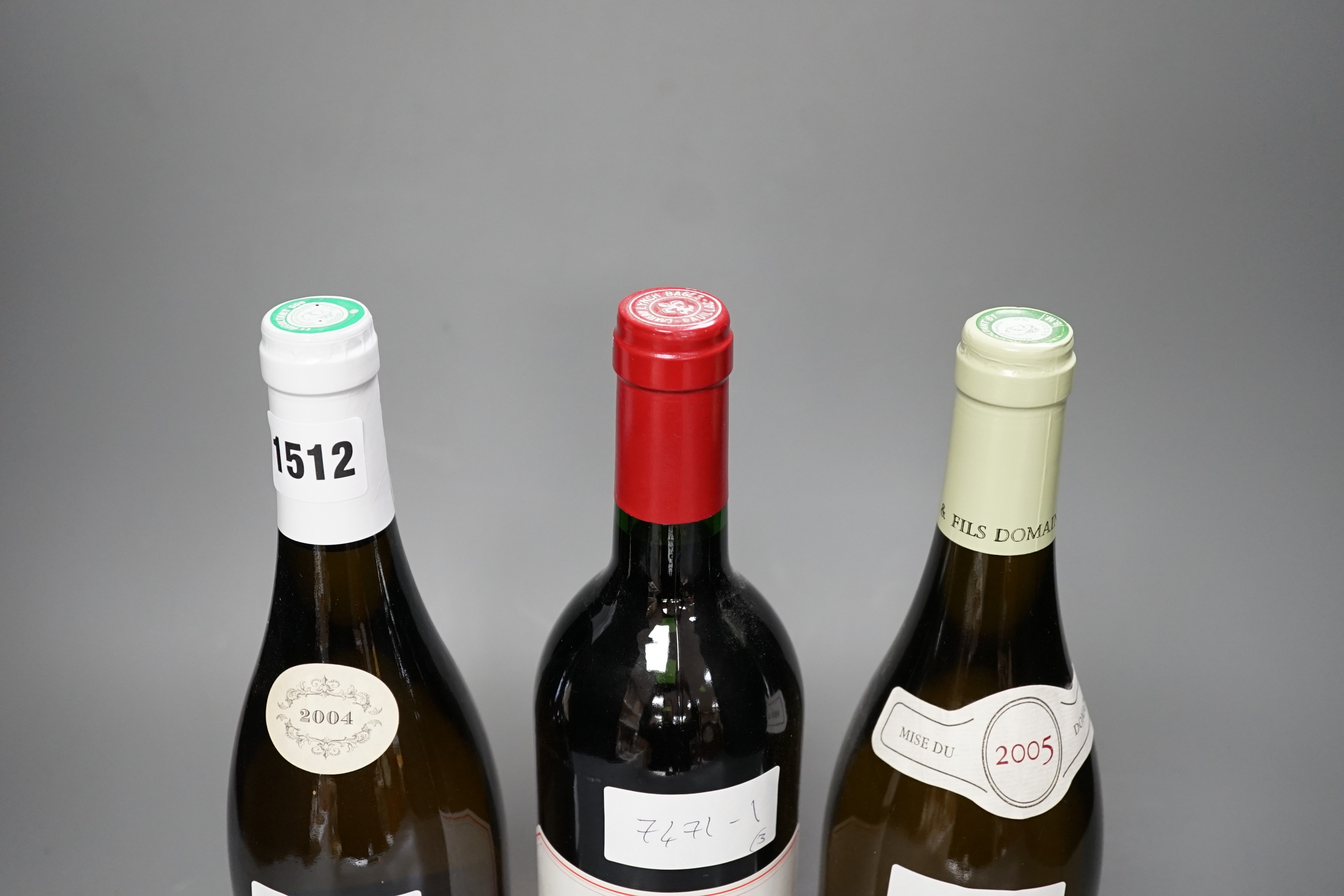 A bottle of Chateau Lynch Bages 1989, one bottle of Chassagne-Montrachet, 2004 and one Puligny Montrachet, 2005